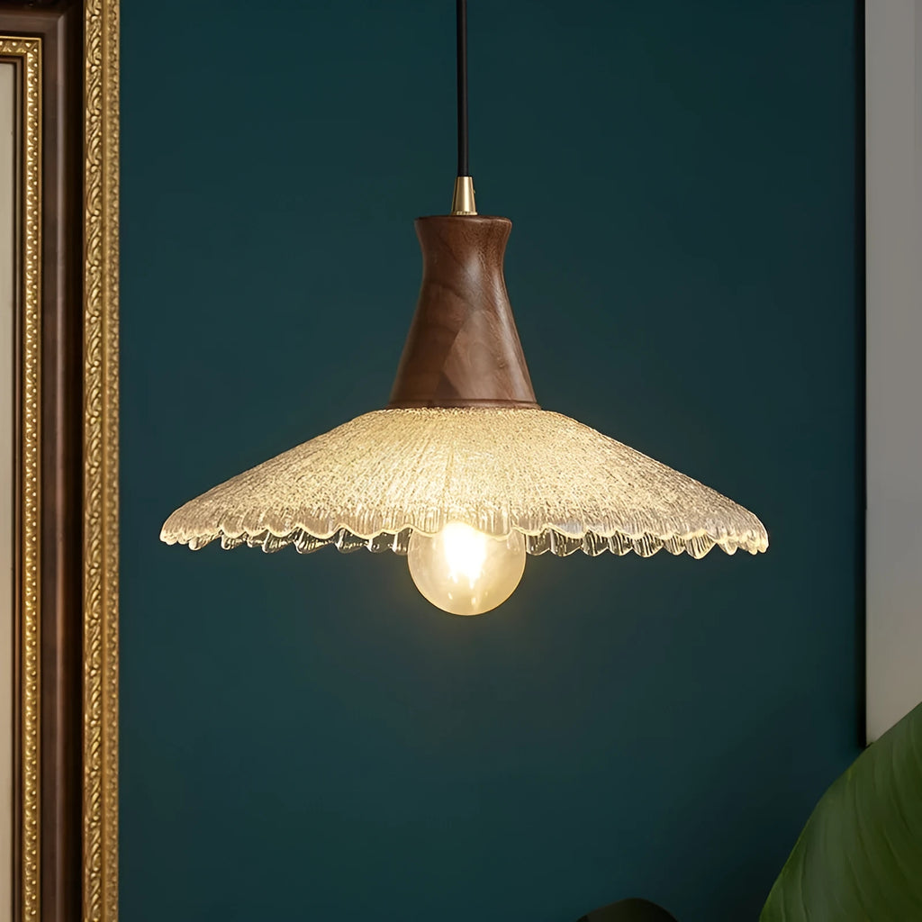 Brass and glass wooden chandelier ceiling light with clear shades in three available sizes.