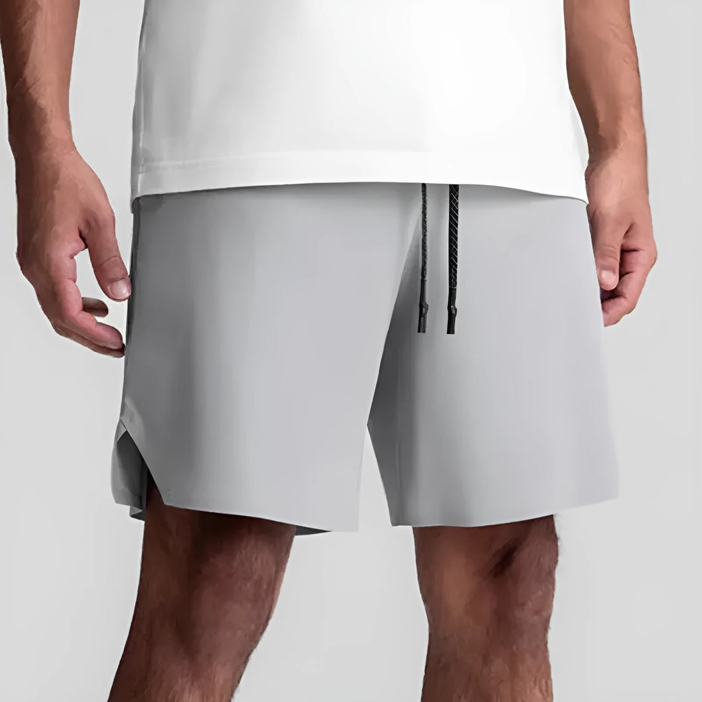 Men's grey seamless sports shorts with straight-leg knee-length design for athletic wear
