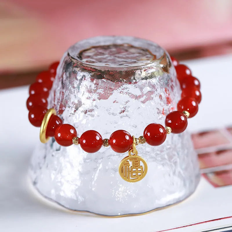 Natural red agate bracelet with woven design and blessing card, shown in 10mm bead size.