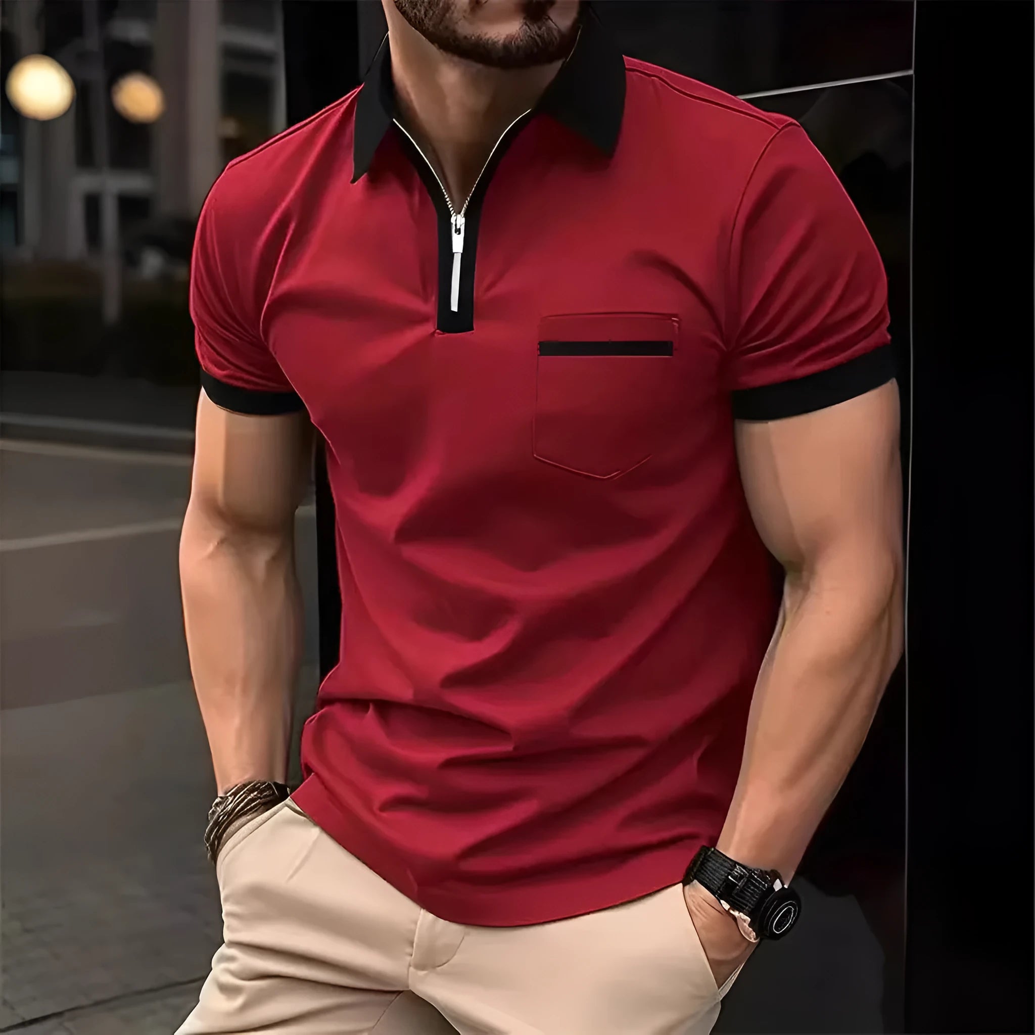 Man wearing a loose fit casual short sleeve shirt with a chest pocket and zipper decoration.
