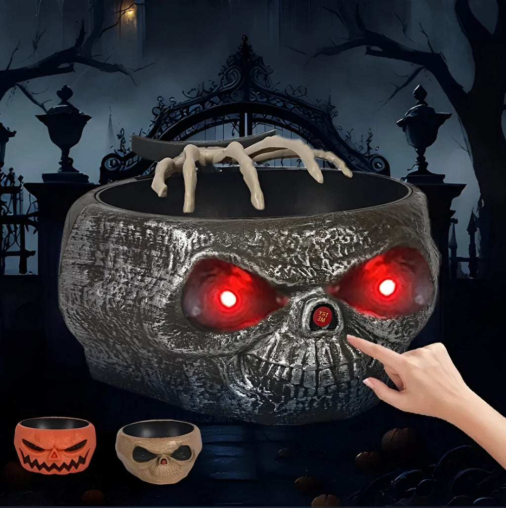 Plastic Halloween pumpkin candy bowl with motion-activated skeleton hand and lighted red eyes
