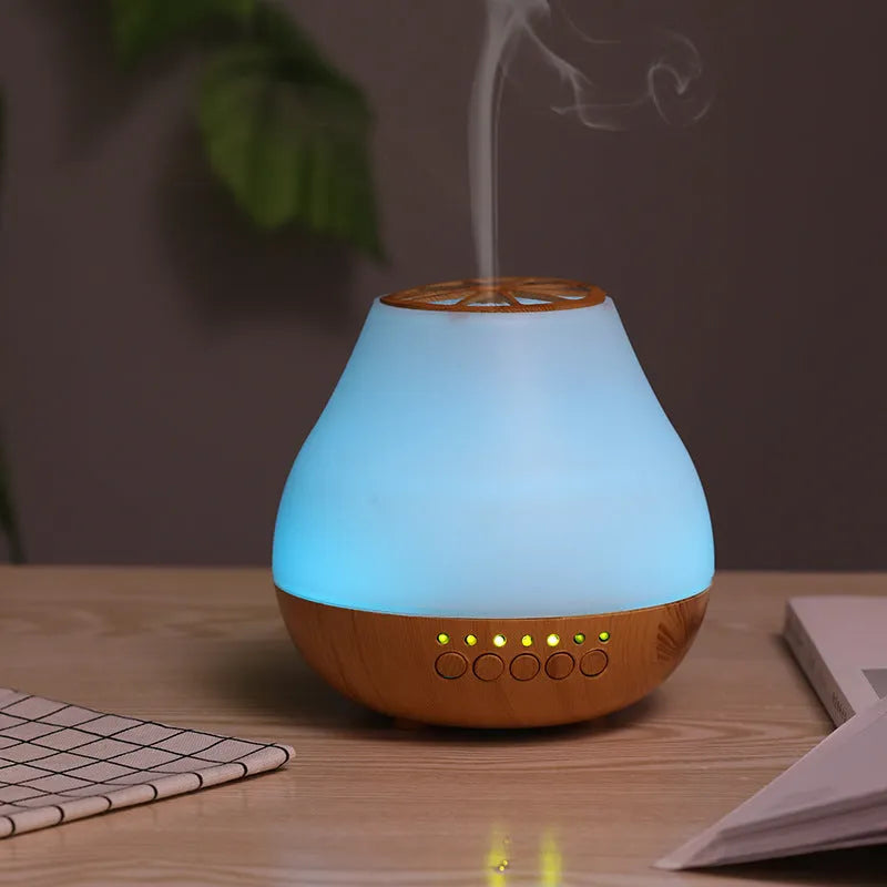 Wood grain finish USB essential oil aroma diffuser with optional Bluetooth control on a table