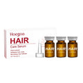 Three small 5ml bottles of clear ginger and pumpkin seed hair root liquid treatment for the scalp.