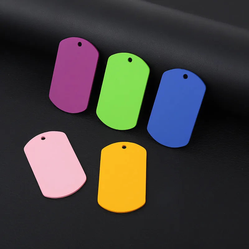 Stainless steel hang tag 49x28mm with coloured string showing monochrome pattern for pet dog ID