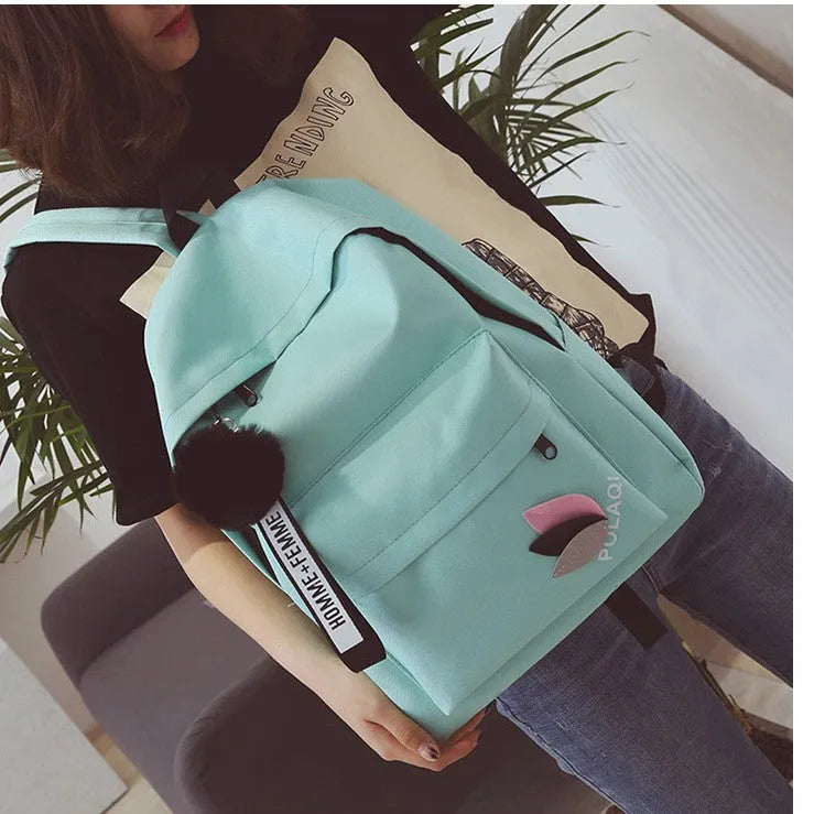 Women's canvas college backpack in green with 20-35L capacity and anti-theft design