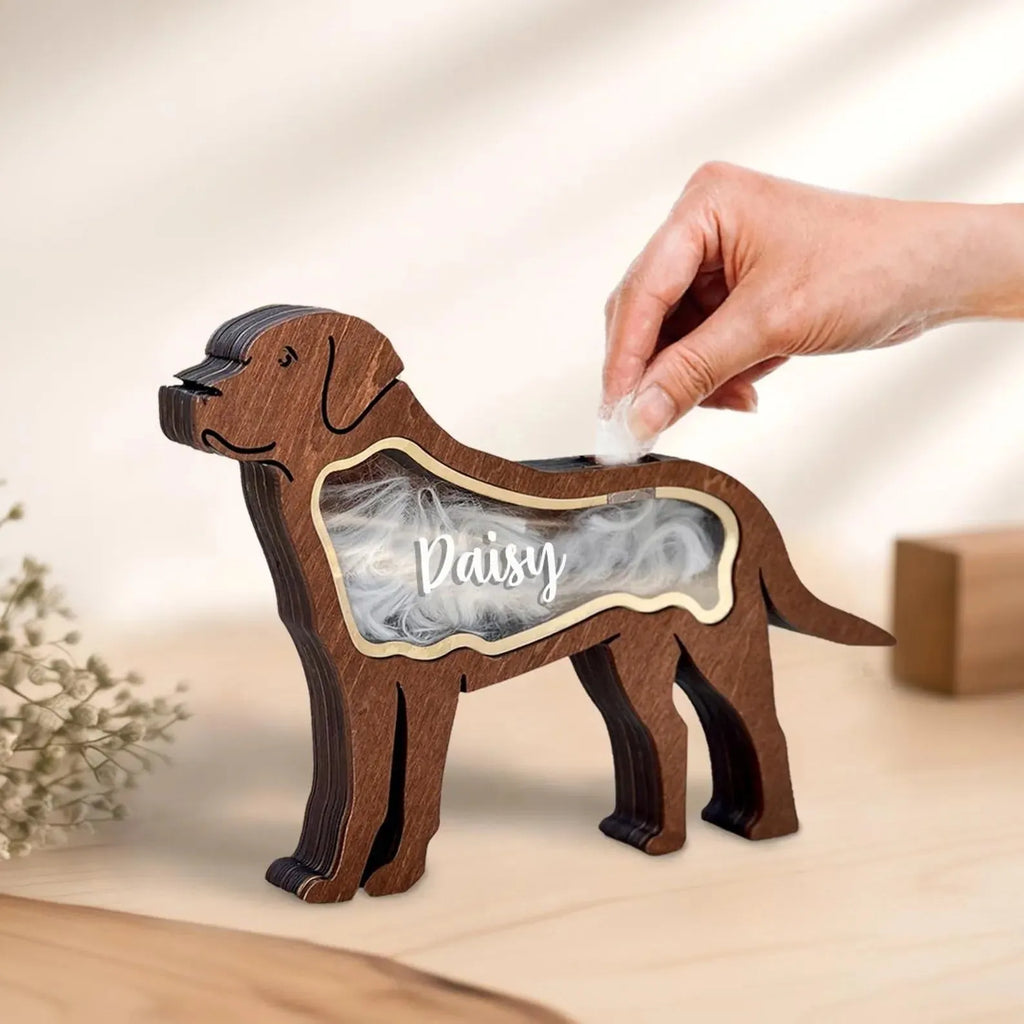 Black wooden box for storing pet grooming tools and brushes.