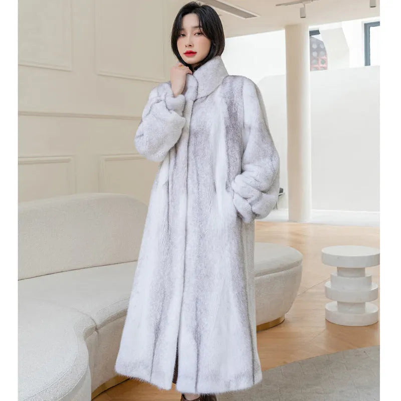 White faux fur coat with a stand-up collar and regular sleeves on a female model.