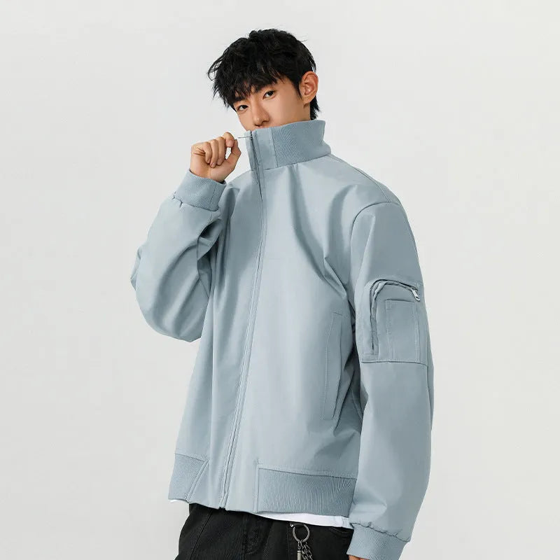 Men's large size multi-pocket short flight jacket in black, loose fit, polyester fiber fabric with visible pockets.