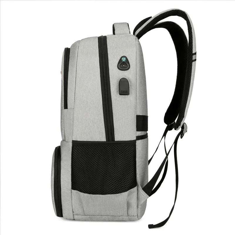 Light grey insulated Oxford cloth backpack with curved shoulder straps and multiple compartments.