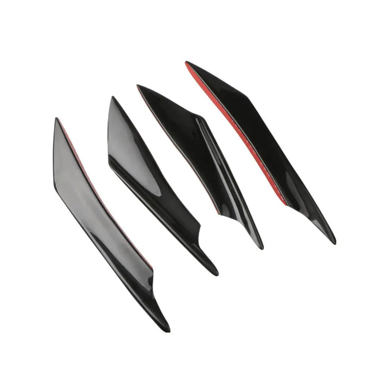Set of four carbon fibre effect ABS plastic bumper spoiler blades for car modification.