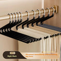 Non-slip Z-shaped trouser hanger in stainless steel dipped finish, shown in cream white, green and black