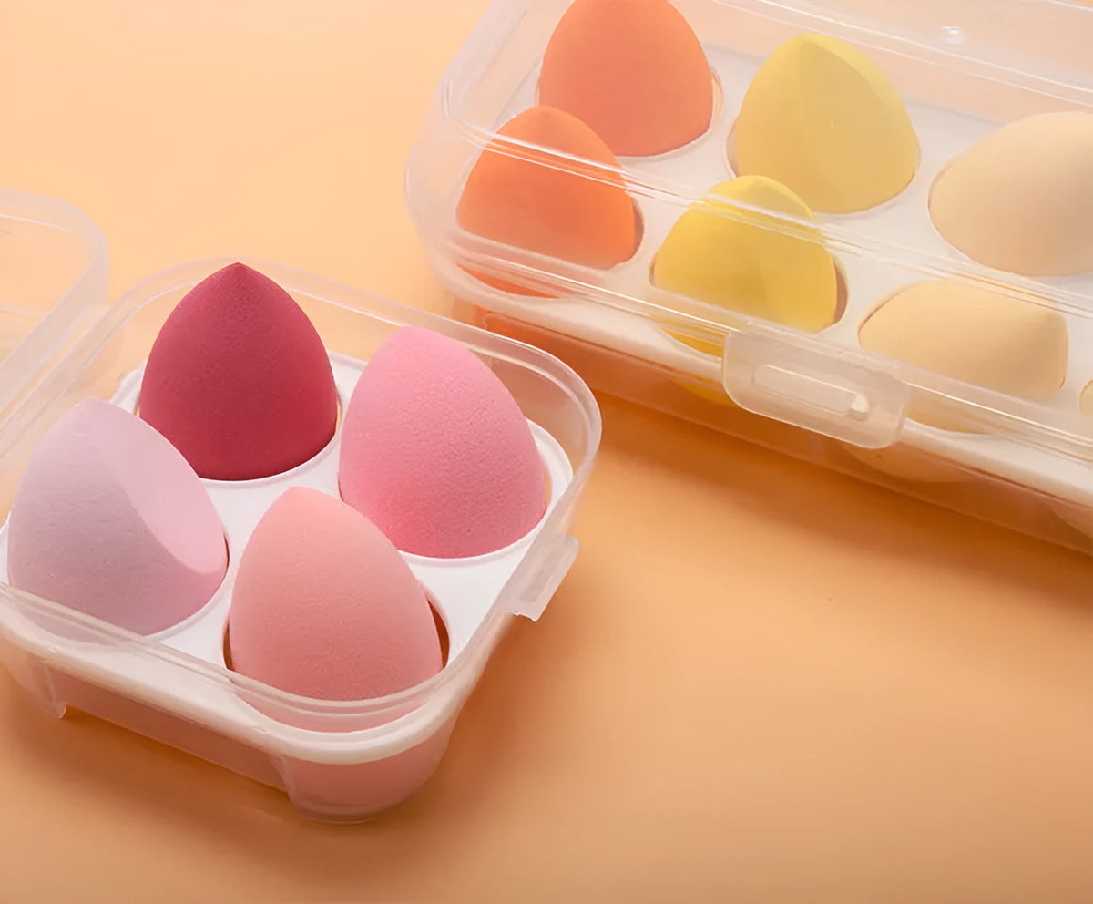 Four makeup sponges 60x40mm diagonal cut in avocado green, mango, strawberry mousse, and grape colours
