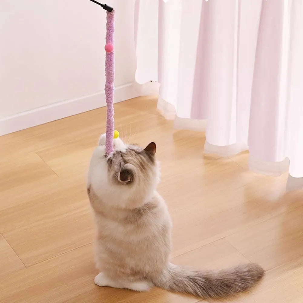 Cat wand toy with long plush strip and colourful ball featuring bells for interactive indoor play