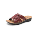 Beige women's cowhide mom sandal slippers with straps and a soft sole on a white background.