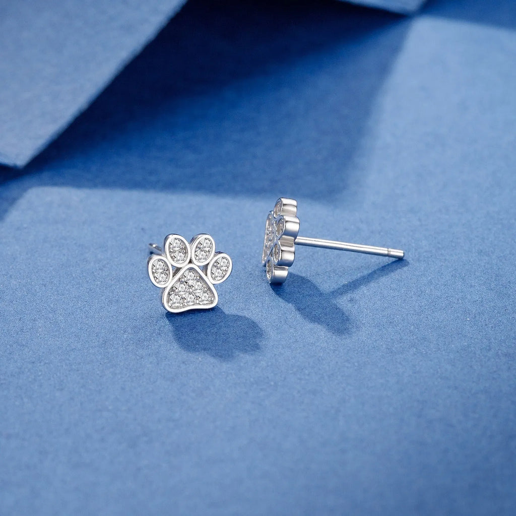 Pair of 925 sterling silver cat's paw stud earrings with full diamond zircon stone setting in silver