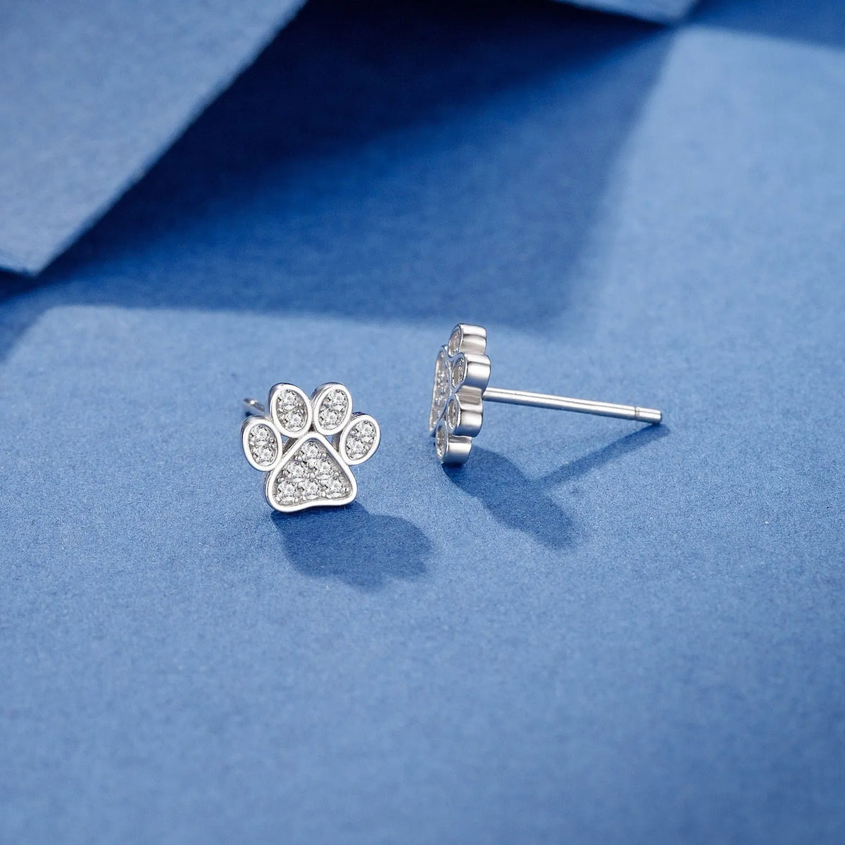 Pair of 925 sterling silver cat's paw stud earrings with full diamond zircon stone setting in silver