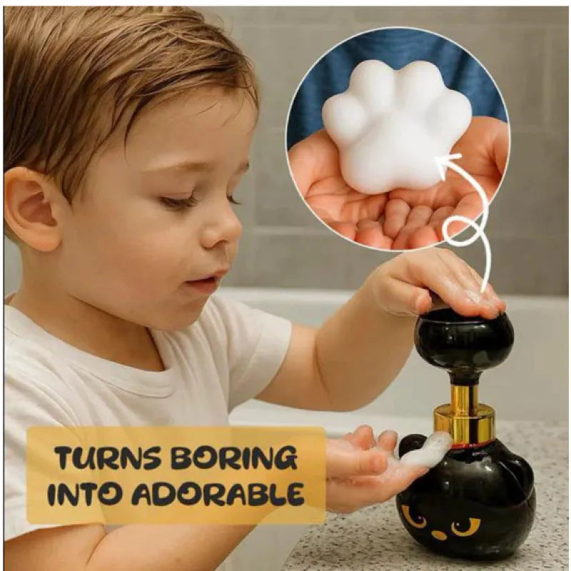 Black plastic cartoon cat-shaped soap extrusion dispenser accessory on countertop