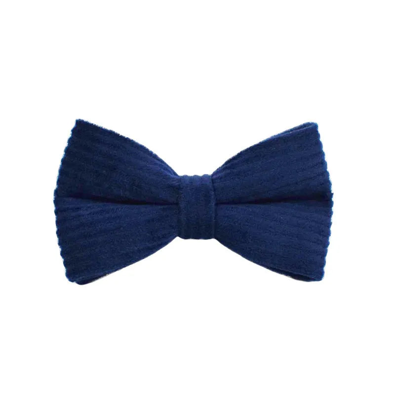 Navy blue corduroy dog collar set with matching leash, vest, bow, and poop bag