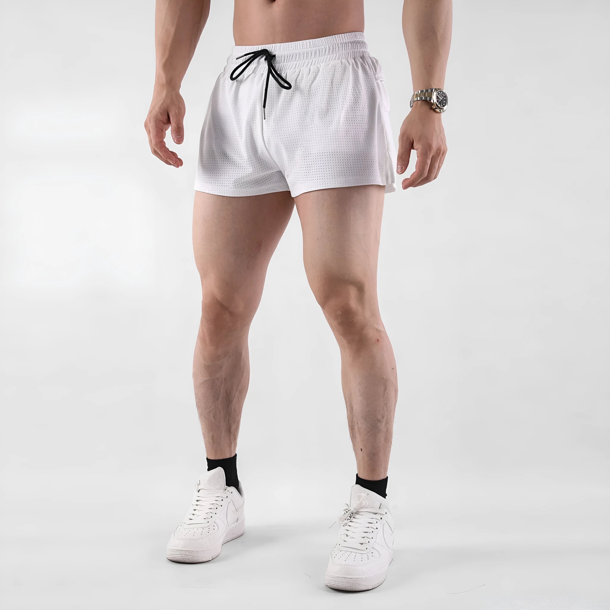 A pair of men's black nylon quick-dry shorts laid flat.