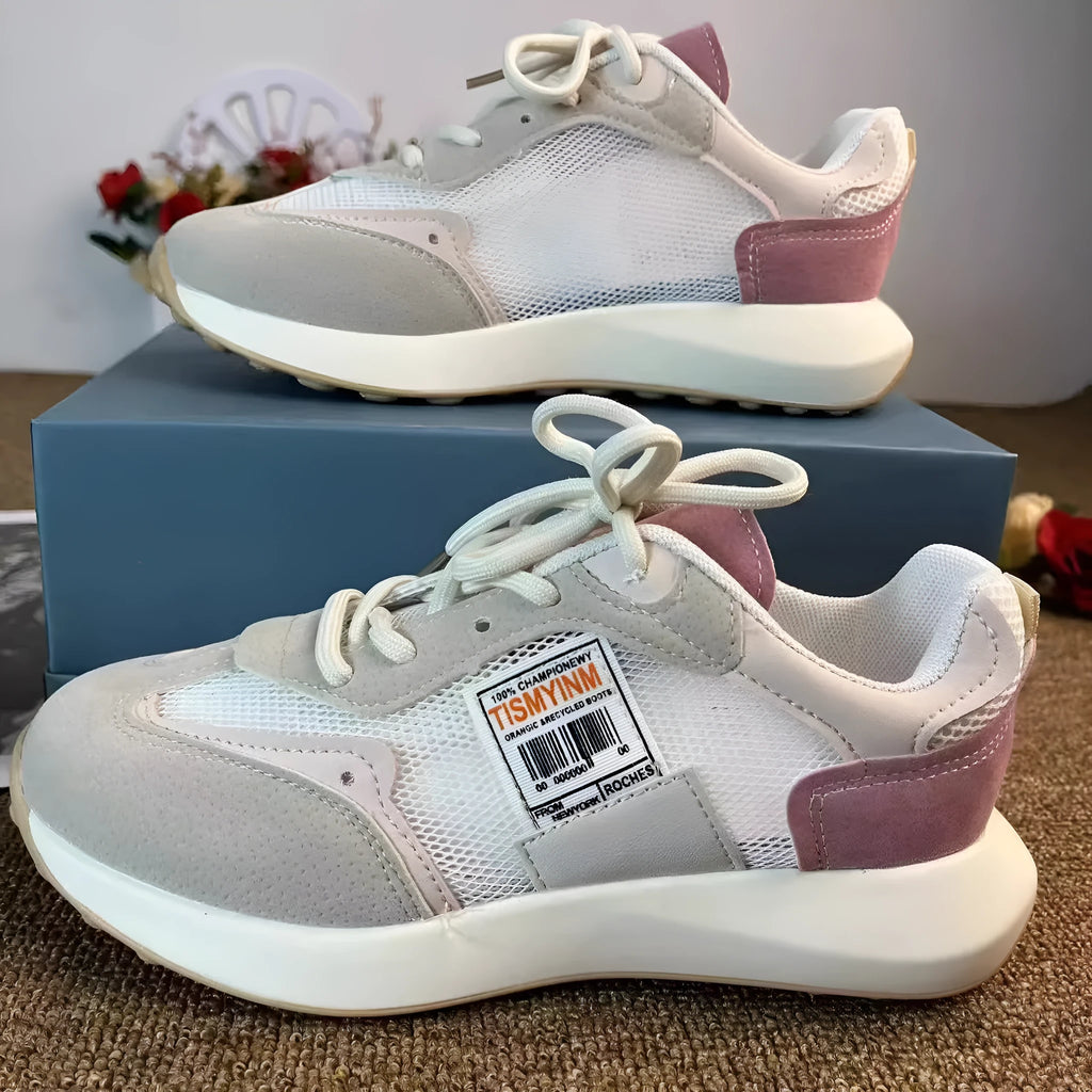Women's grey and pink retro sneaker with low-top design and round toe