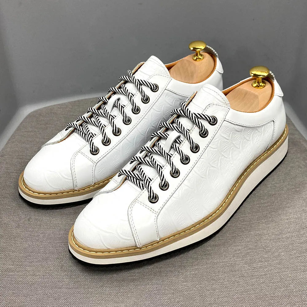 Men's low-top white shoes with embossed pattern texture, featuring lace-up front and microfiber lining.
