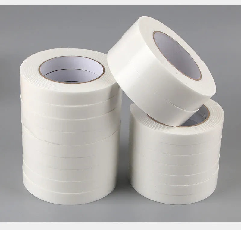 Roll of 3mm thick white foam double-sided adhesive tape with clear BOPP liner, showing width options.