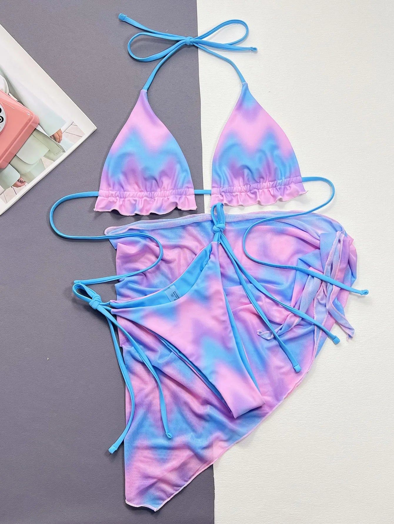 Women's tie-dye bikini swimsuit with split-front design and matching bra and briefs