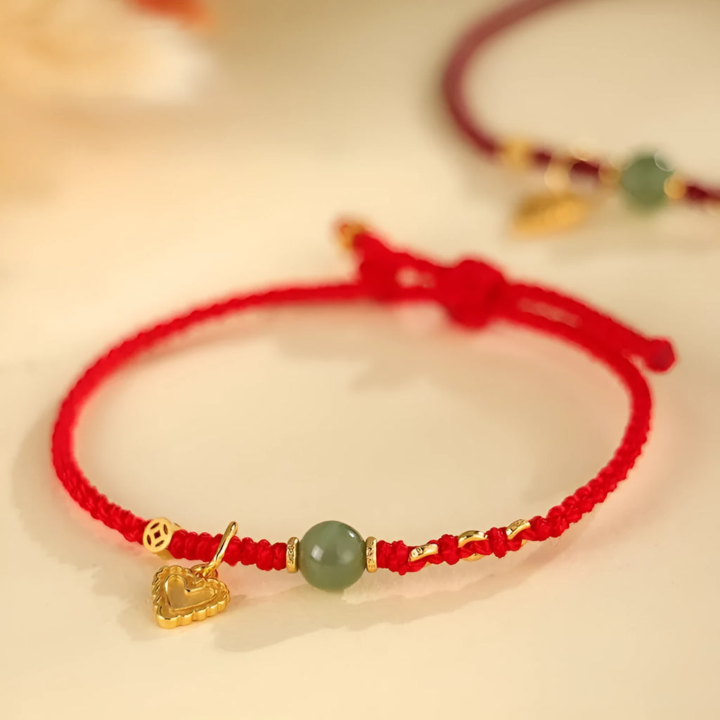 Handmade woven women's bracelet with 925 silver and red Hetian jade beads on adjustable carrying strap