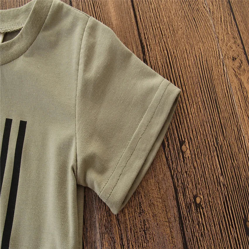 A little boy's camouflage print short sleeve shirt and pants summer suit set.