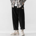 Men's loose straight corduroy sports trousers in Army Green colour showing mid-waist and full length design