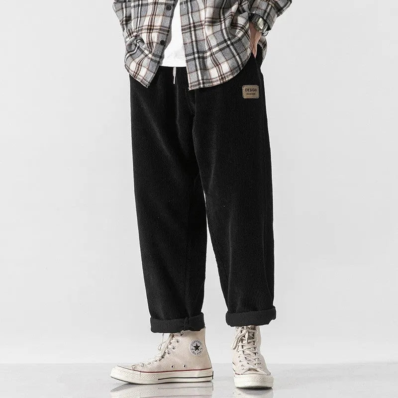 Men's loose straight corduroy sports trousers in Army Green colour showing mid-waist and full length design