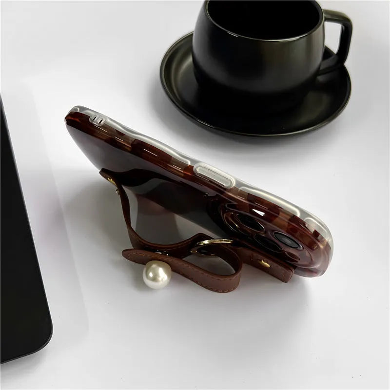 Brown leopard print silicone iPhone case with leather wristband, anti-fall, compatible with iPhone 11 to 15 Pro Max