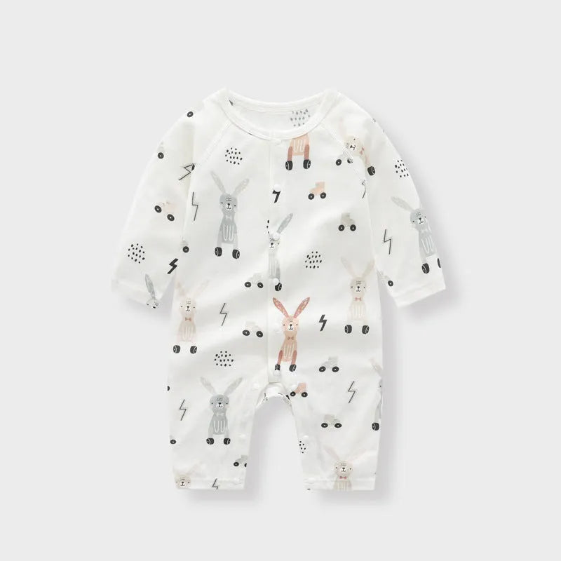 Baby wearing a soft bamboo fibre jumpsuit with a cute Nordic animal print, long sleeves.