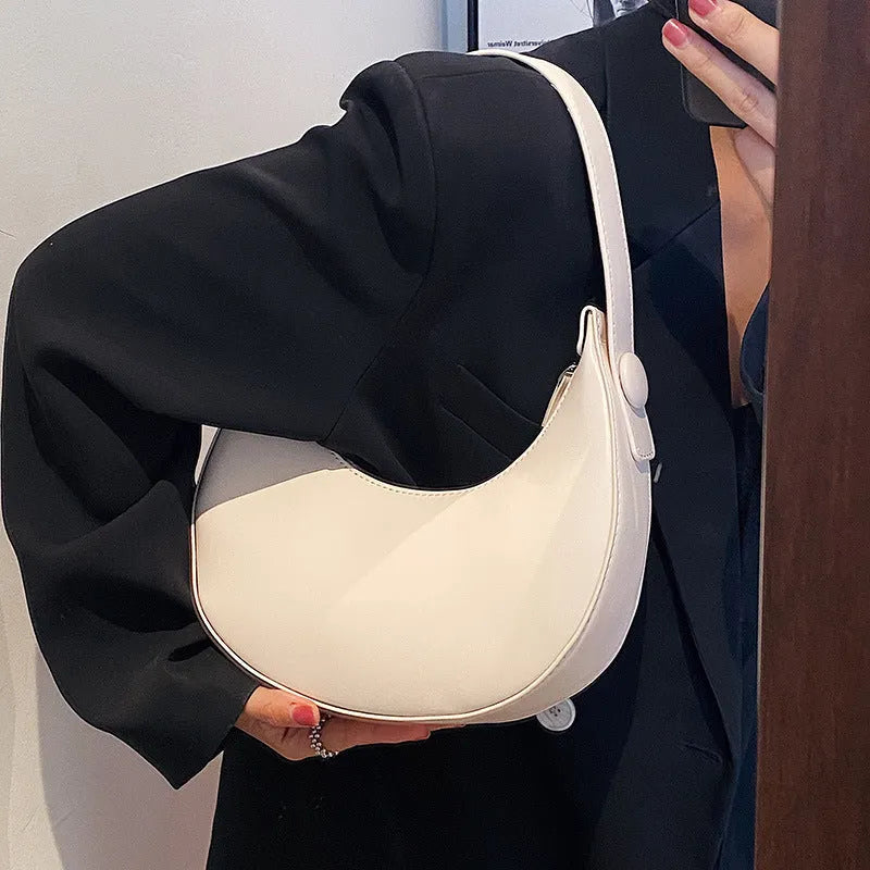 Retro dumpling-shaped women's shoulder bag in PU, shown in cream yellow, with dimensions 21x20x6cm.