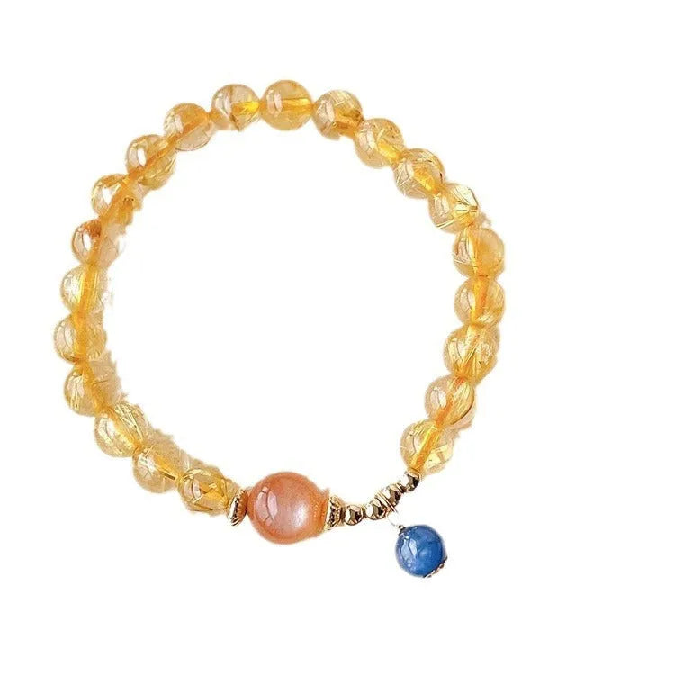 Gold rutilated quartz and sunstone crystal bracelet with diamond beads on adjustable band