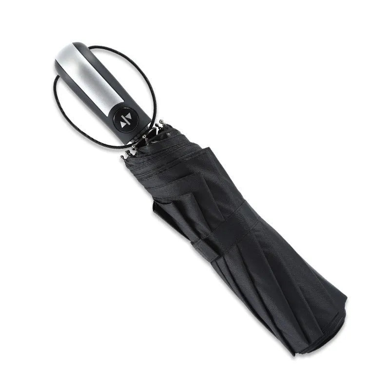 Black automatic triple folding business umbrella with steel ribs and a rubber handle.