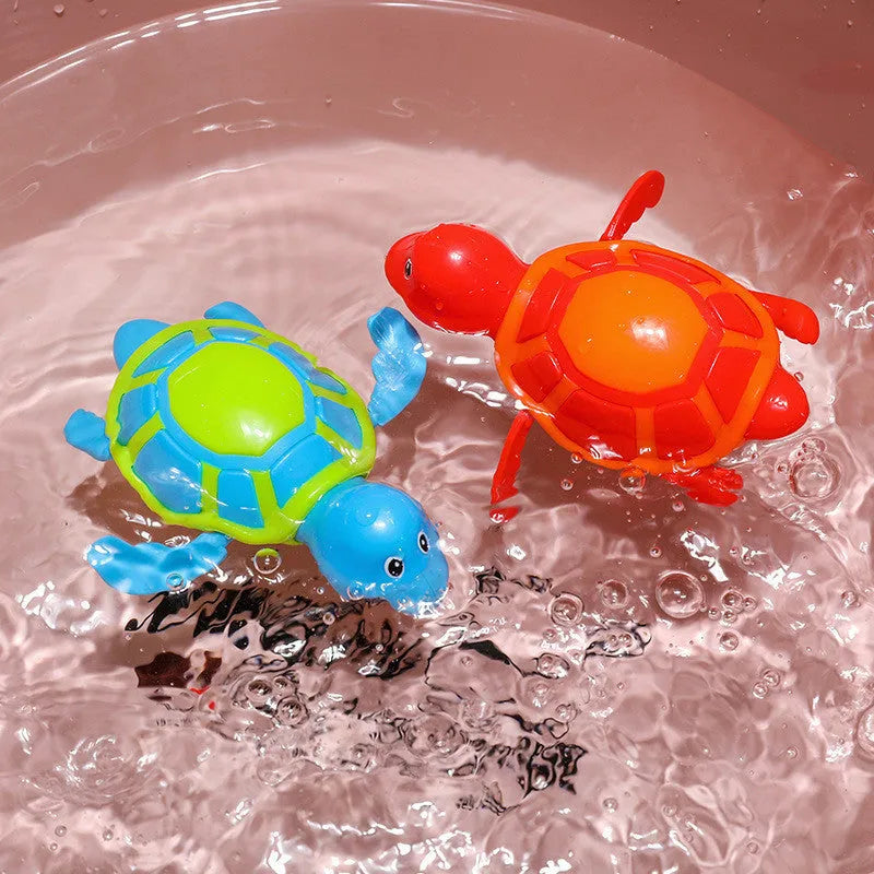 Plastic baby tortoise bath toy floating in water for infant bath time play
