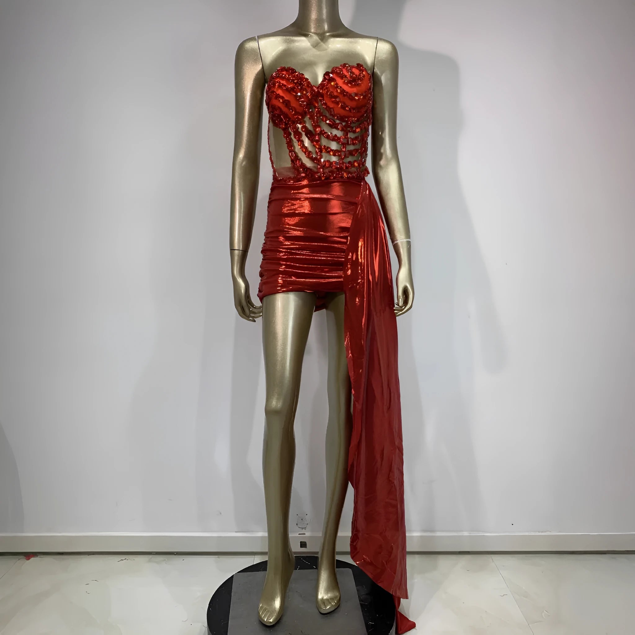 Red women's skirt suit with see-through mesh panels, a stage and party costume in stretch spandex.