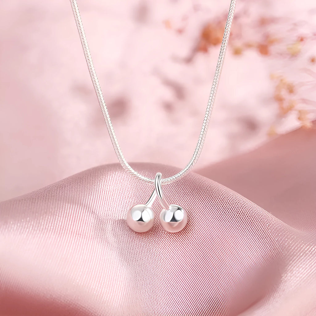 Silver cherry necklace for women with snake bone chain and adjustable length.