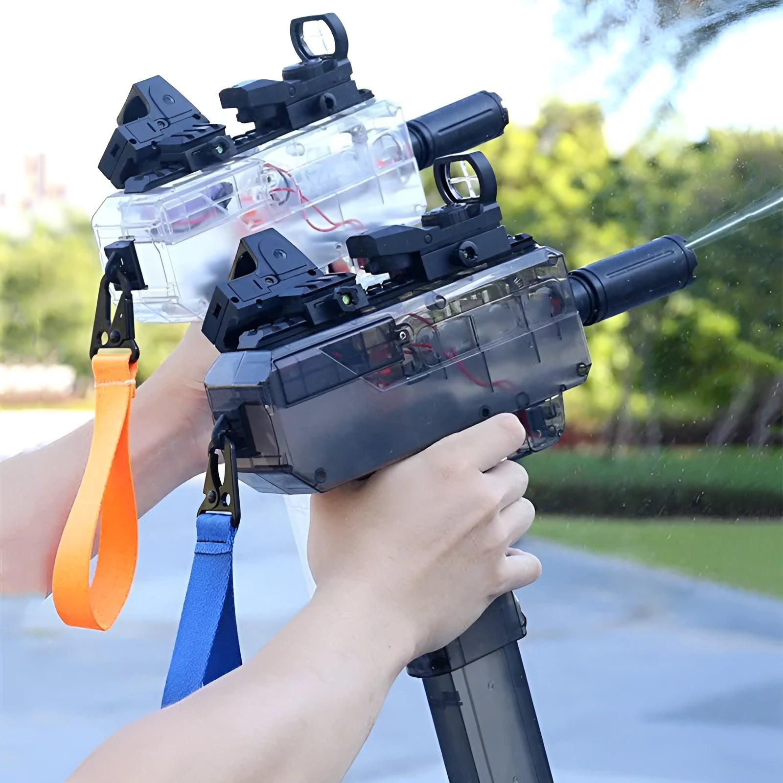 Uzi style electric water gun toy with transparent blue plastic body and attached accessories on a white background.