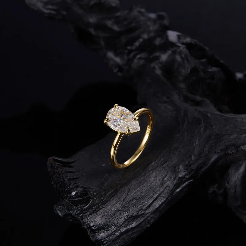 Pear-shaped moissanite ring in silver, 7x11mm stone, simple single diamond style, size 7 shown