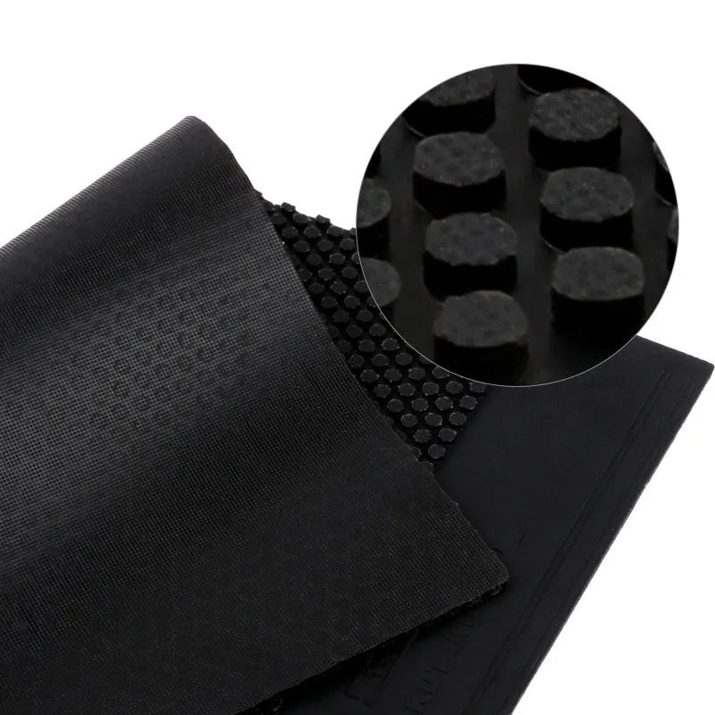 Single sheet of black and red raw rubber for table tennis rackets with a small pimple surface texture.