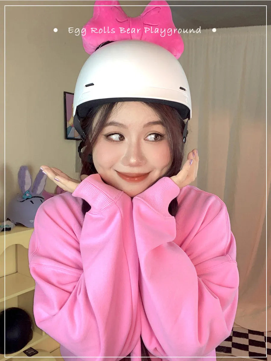 Soft plush bow decoration for helmets in red, peach pink, and rose pink colour options.