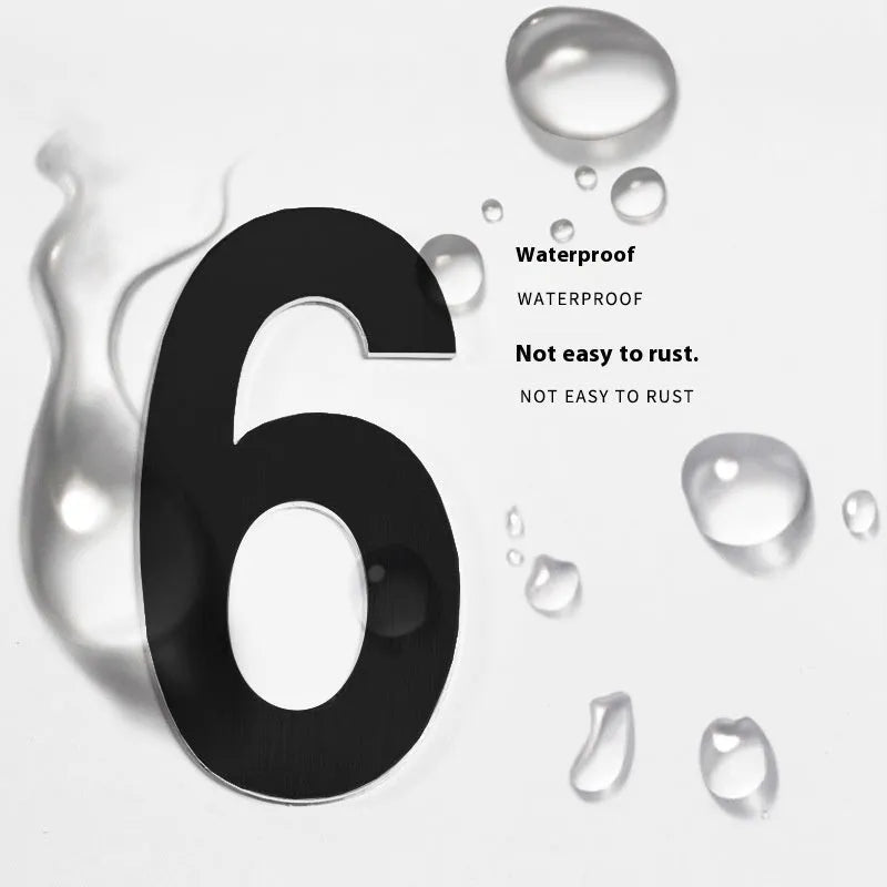 Stainless steel adhesive house number with 7.5cm black characters showing sample numbers and letters