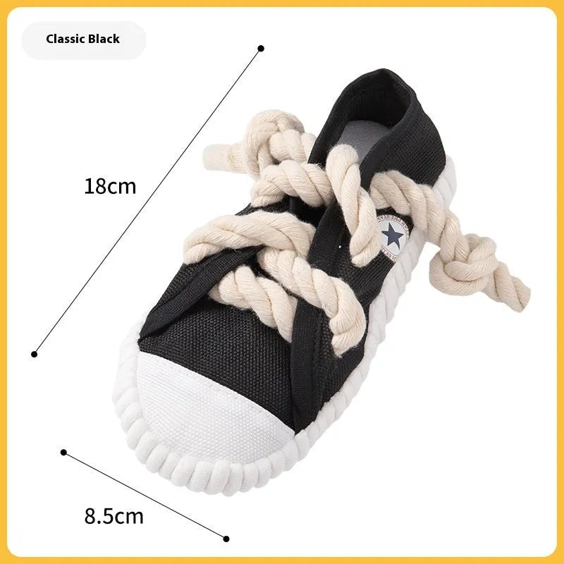 Yellow plastic dog chew toy shaped like slippers, with a sound mechanism for pet play.