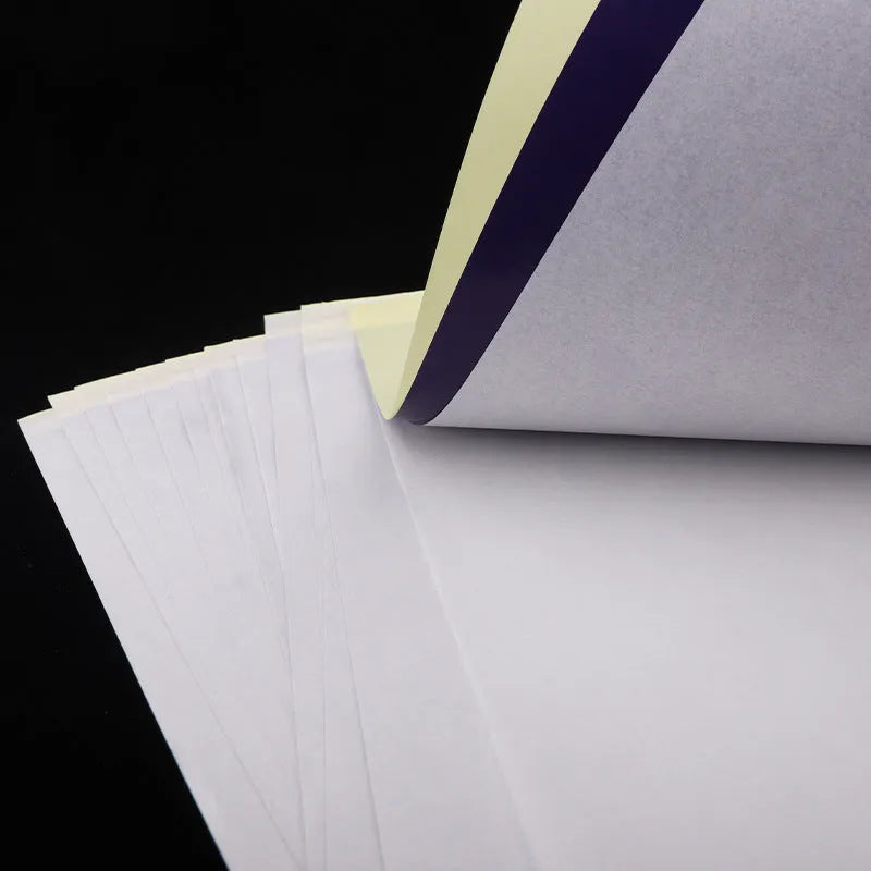 A4 tattoo transfer paper sheets with clear guide lines and a tube of transfer paste gel.