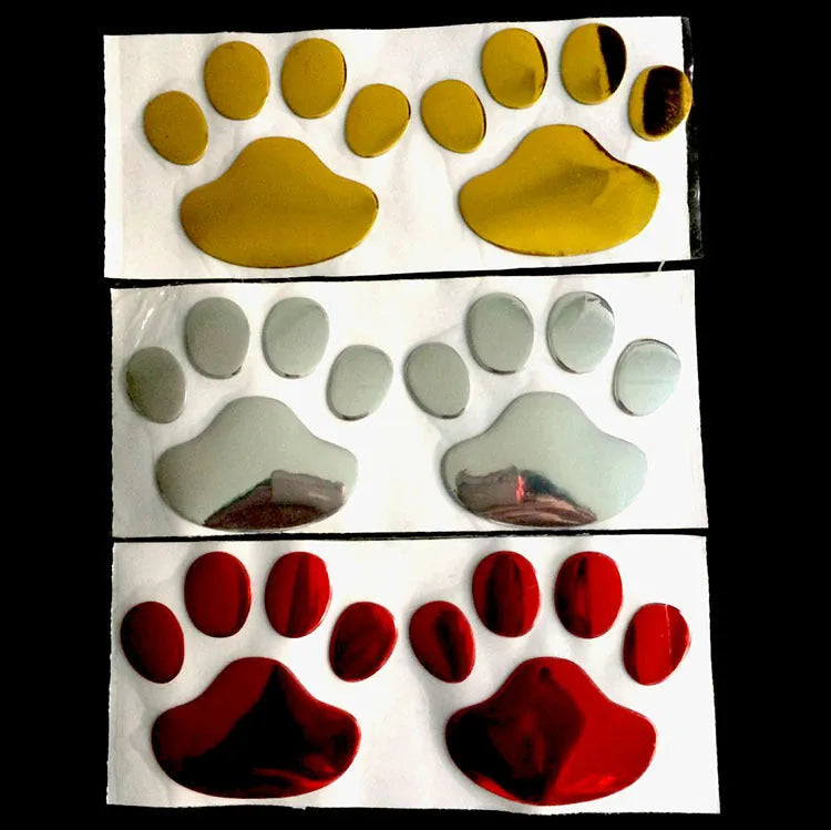 PVC car sticker shaped like a hand holding a brush, decorated with dog footprints pattern.