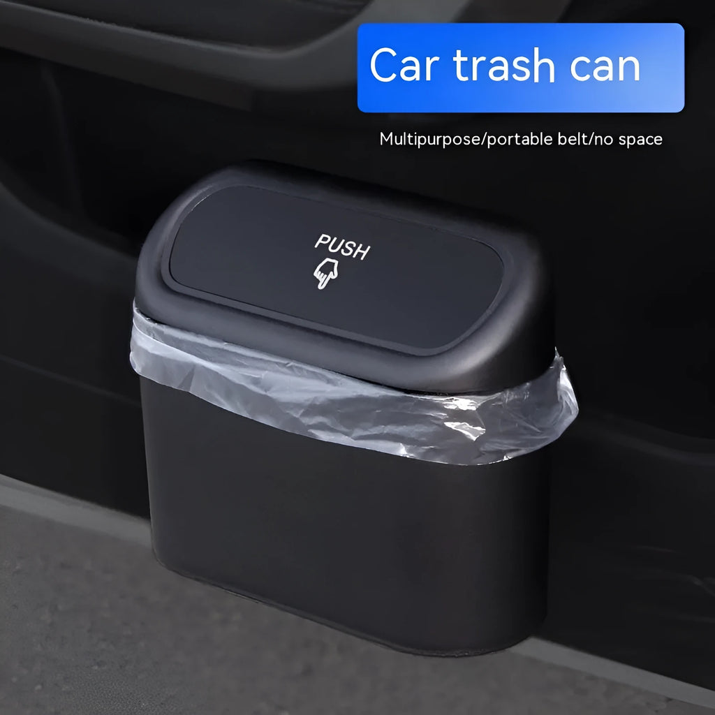 Black plastic folding car trash can placed between vehicle seats.
