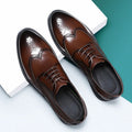 A pair of men's classic black brogue business shoes with a PU leather upper.