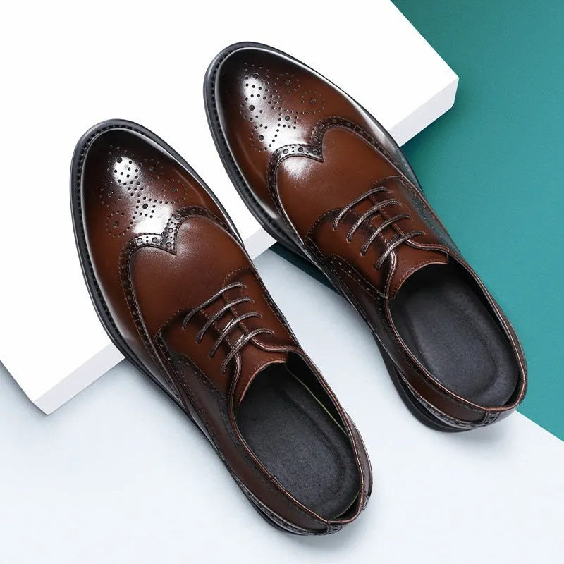 A pair of men's classic black brogue business shoes with a PU leather upper.